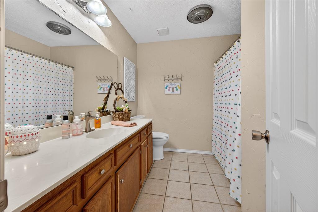 209 Colonial Circle Athens, TX 75751 - Photo 8 of 22 a bathroom with a sink a vanity and a mirror