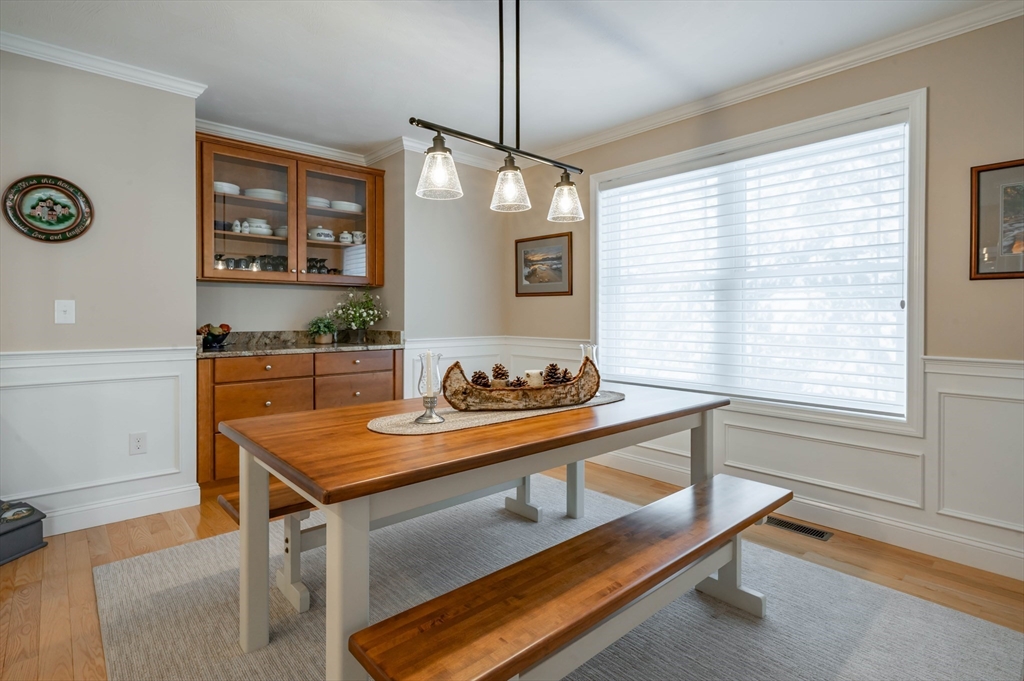 9 Pilgrim Circle Nashua, NH 03063 - Photo 12 of 39 a dining room with table and chair