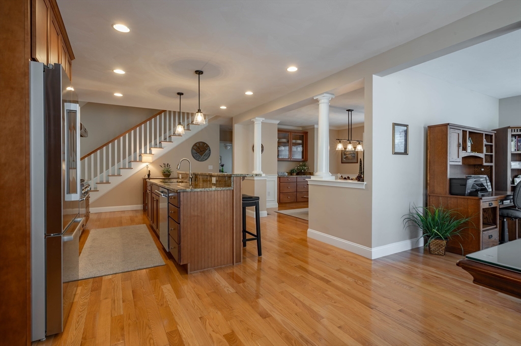 9 Pilgrim Circle Nashua, NH 03063 - Photo 14 of 39 a view of a living room and a kitchen