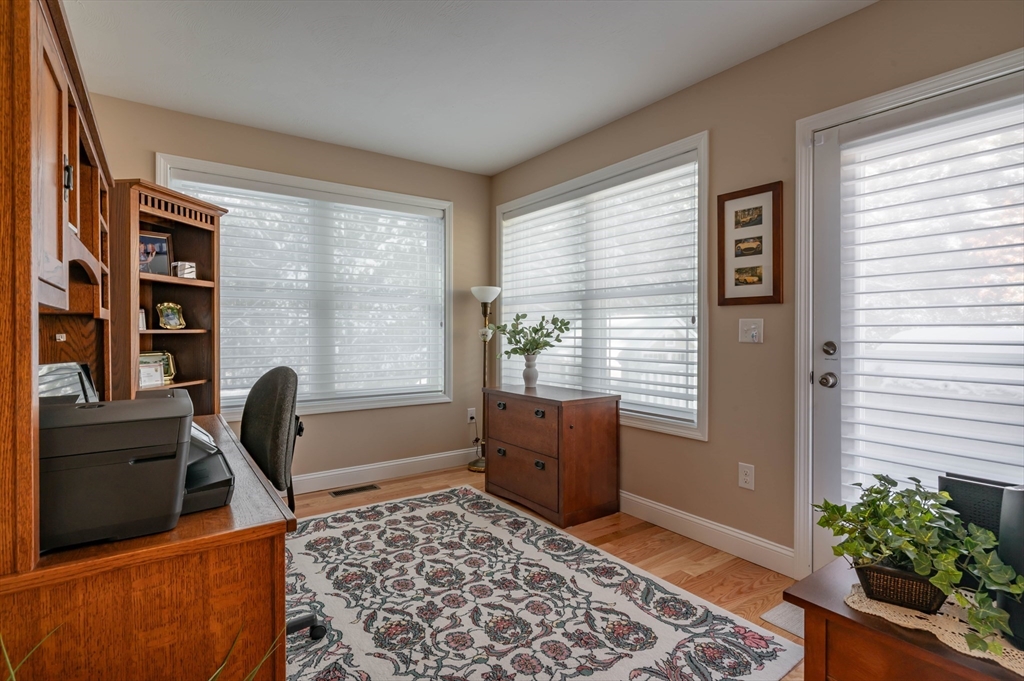 9 Pilgrim Circle Nashua, NH 03063 - Photo 16 of 39 a view of a workspace with furniture and a window