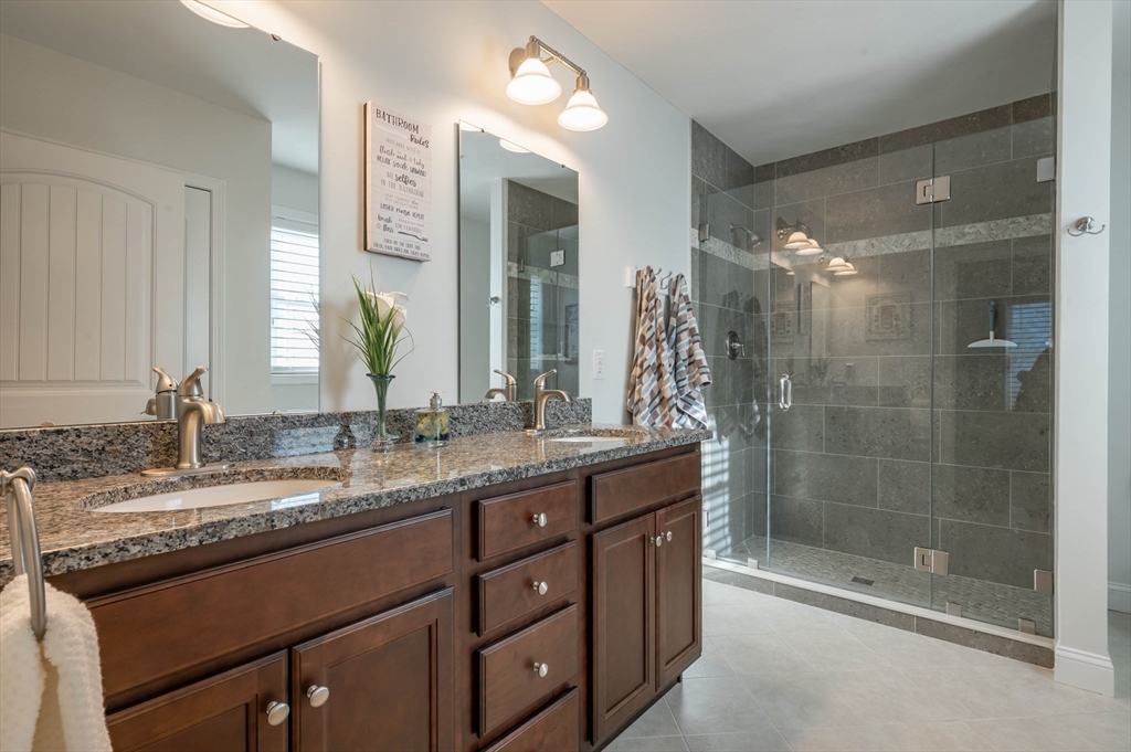 9 Pilgrim Circle Nashua, NH 03063 - Photo 21 of 39 a bathroom with a granite countertop sink mirror and double