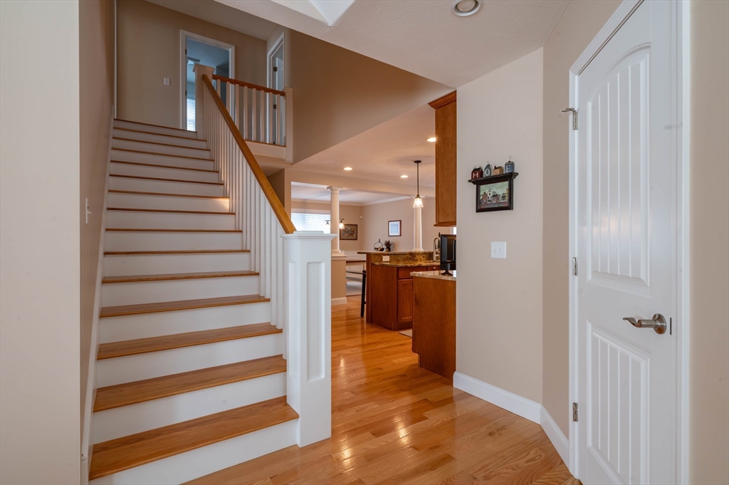 9 Pilgrim Circle Nashua, NH 03063 - Photo 22 of 39 a view of entryway and hall with wooden floor