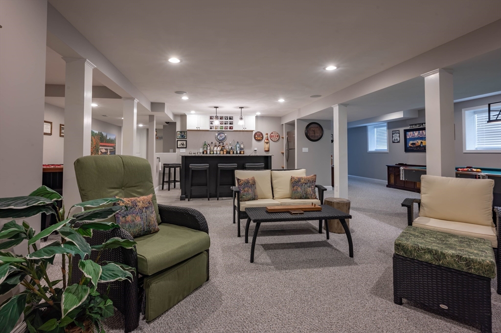 9 Pilgrim Circle Nashua, NH 03063 - Photo 32 of 39 a living room with furniture and a couch
