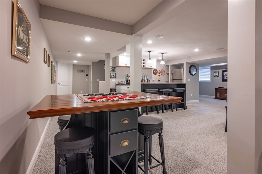 9 Pilgrim Circle Nashua, NH 03063 - Photo 33 of 39 a view of kitchen island with granite countertop furniture and a refrigerator