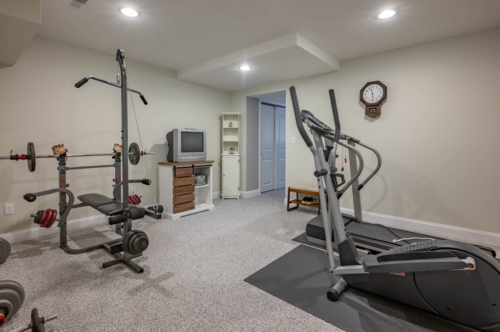 9 Pilgrim Circle Nashua, NH 03063 - Photo 35 of 39 a view of a room with gym equipment