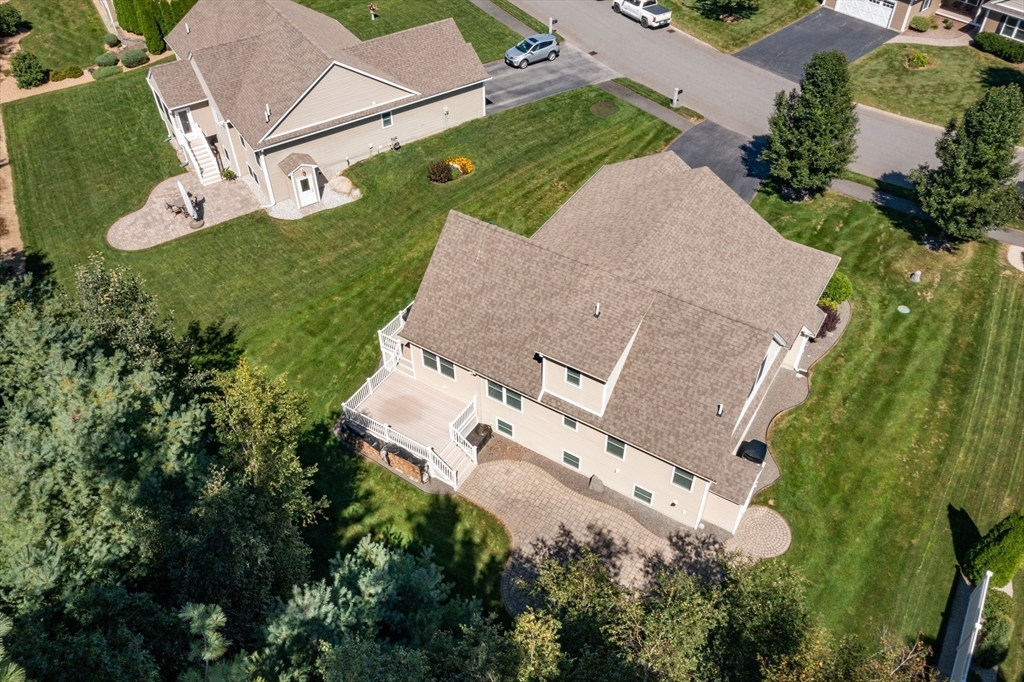 9 Pilgrim Circle Nashua, NH 03063 - Photo 39 of 39 an aerial view of a house with a yard and trees