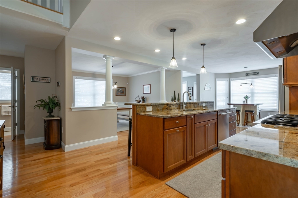 9 Pilgrim Circle Nashua, NH 03063 - Photo 5 of 39 a large kitchen with a large counter top appliances and cabinets