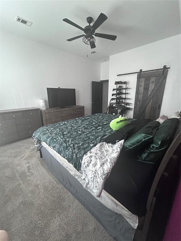 324 Bronco Drive Pilot Point, TX 76258 - Photo 11 of 17 a bedroom with a bed and two windows