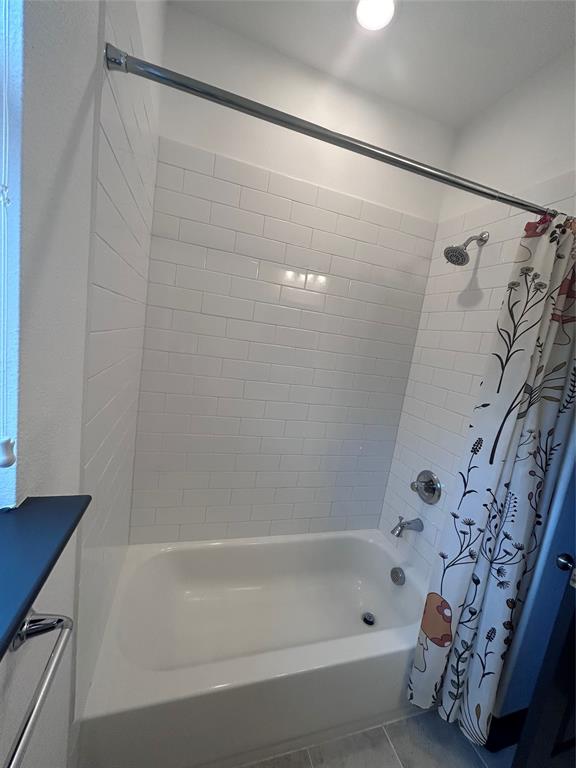 324 Bronco Drive Pilot Point, TX 76258 - Photo 14 of 17 a bathroom with a bathtub and shower