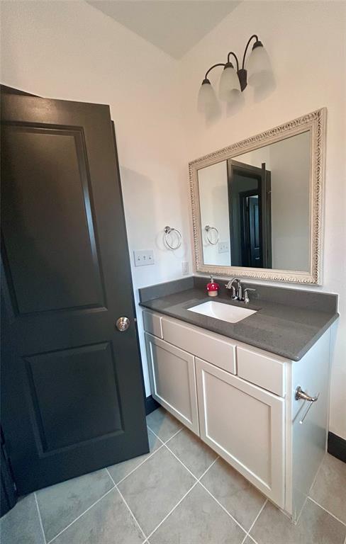 324 Bronco Drive Pilot Point, TX 76258 - Photo 15 of 17 a bathroom with a sink and a mirror