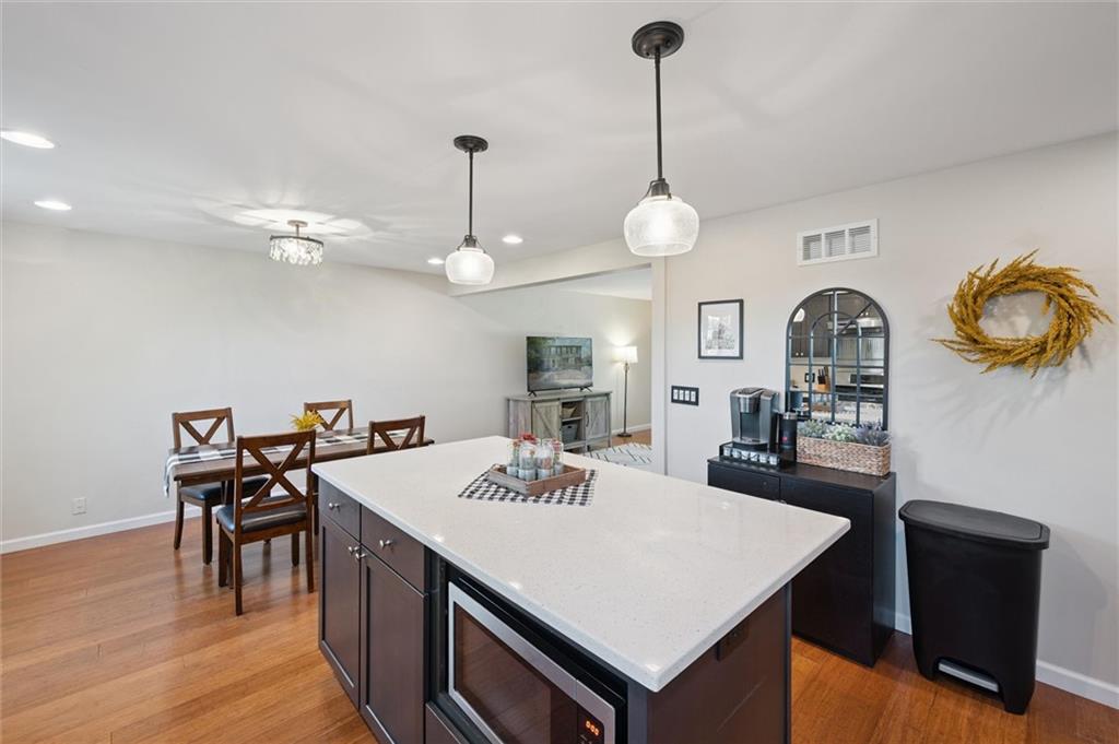 129 Kings Drive Monaca, PA 15061 - Photo 13 of 36 a view of a dining room with furniture and wooden floor