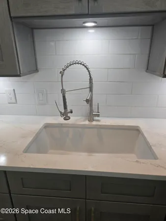 a bathroom with a shower and a sink