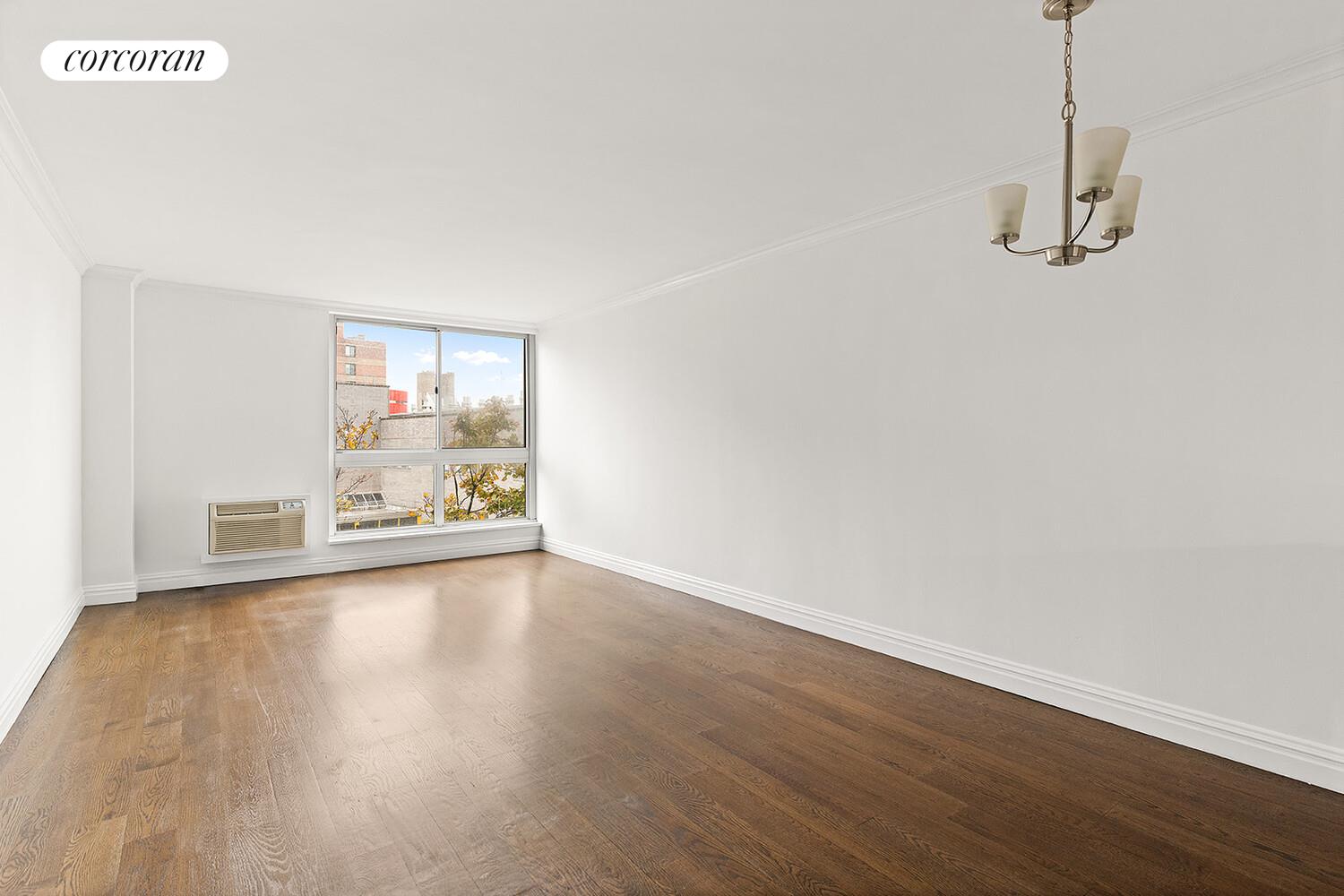 625 Main Street, Unit 643 Manhattan, NY 10044 - Photo 2 of 15 a view of a room with wooden floor and window