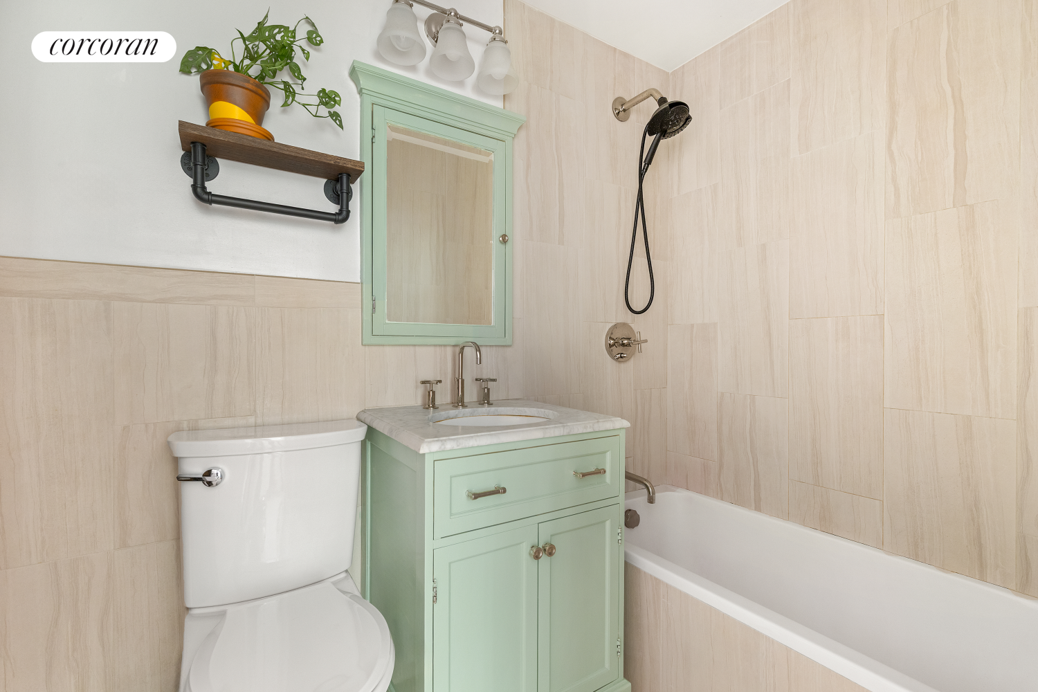 625 Main Street, Unit 643 Manhattan, NY 10044 - Photo 5 of 15 a bathroom with a bath tub toilet and sink