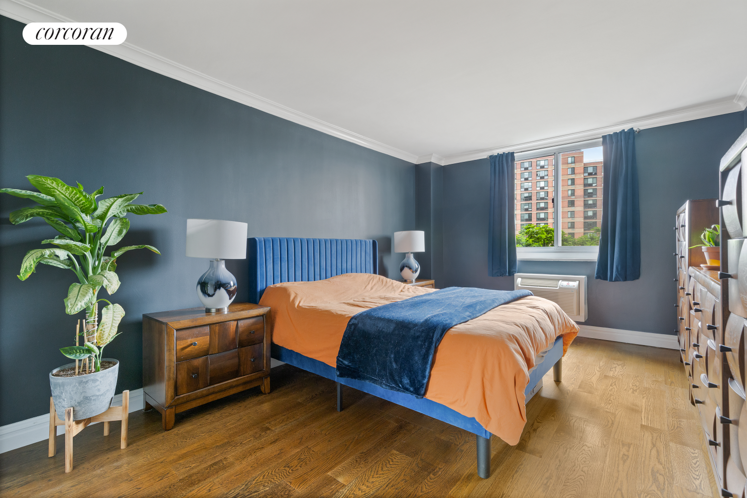 625 Main Street, Unit 643 Manhattan, NY 10044 - Photo 7 of 15 a bedroom with a bed table flowerpot and window