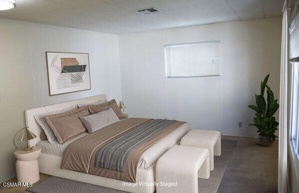 195 Tierra Rejada Road, Unit 197 Simi Valley, CA 93065 - Photo 7 of 28 a bedroom with a bed and a potted plant