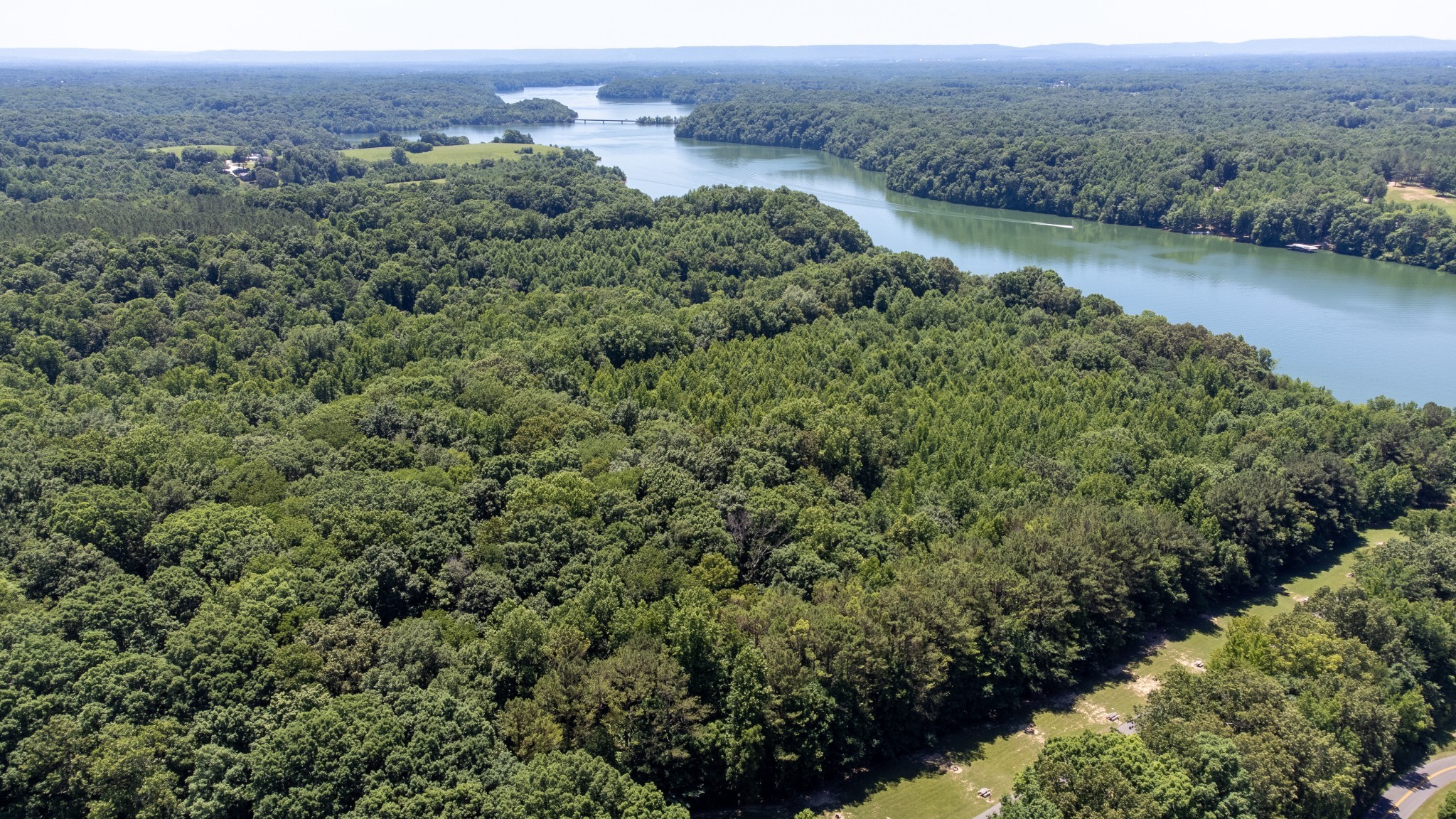 0 Turkey Creek Boat Dock Road Tullahoma, TN 37388 - Photo 24 of 39 an aerial view of green landscape with trees houses and lake view