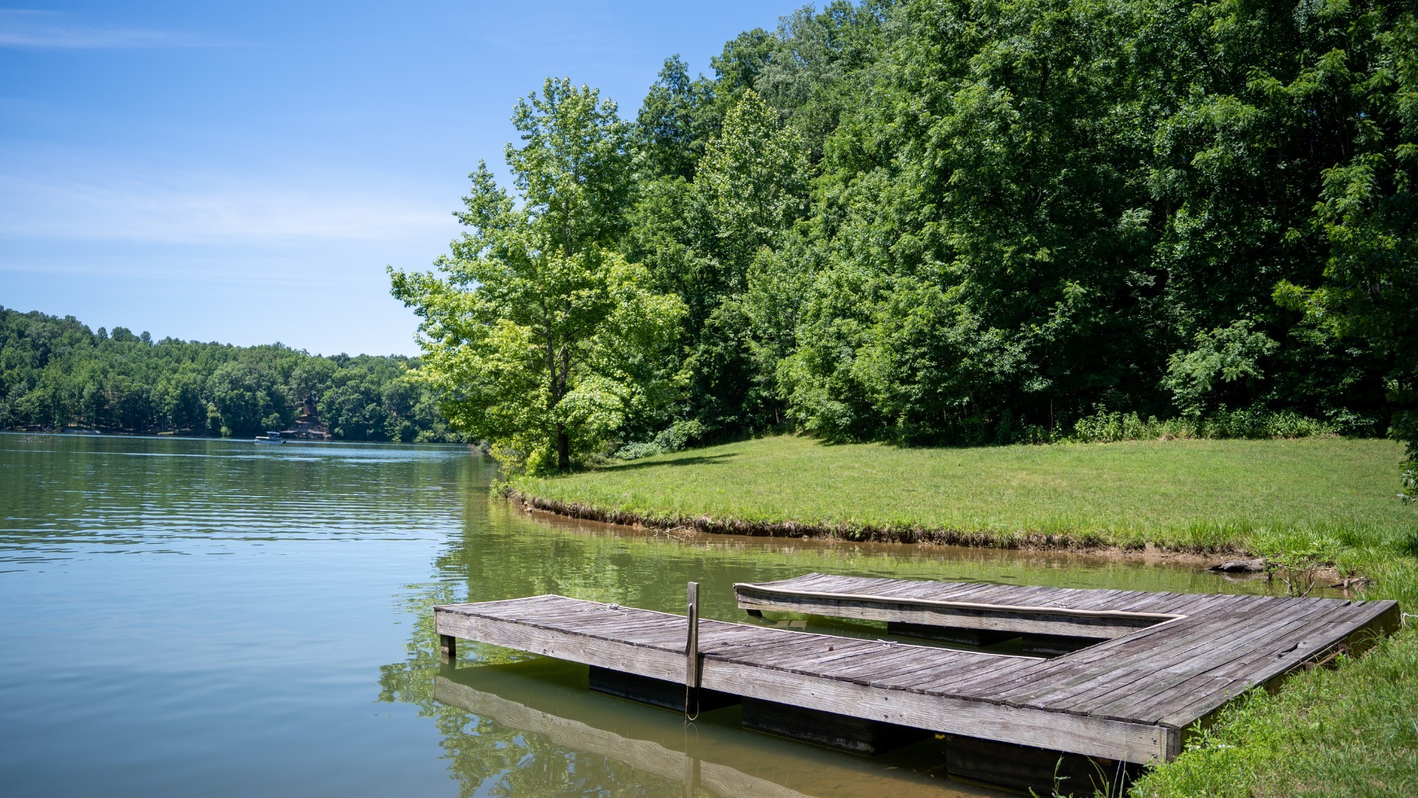 0 Turkey Creek Boat Dock Road Tullahoma, TN 37388 - Photo 30 of 39 a view of a lake with a yard and large trees