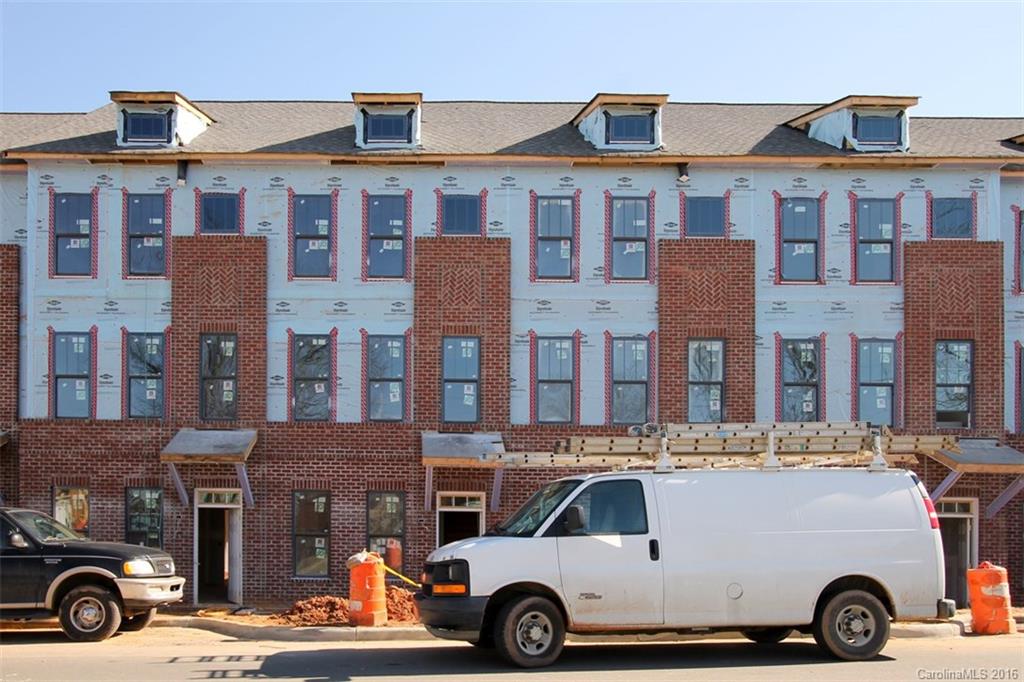 556 Jetton Street, Unit 3 Davidson, NC 28036 - Photo 6 of 12 a front view of a building with parking space