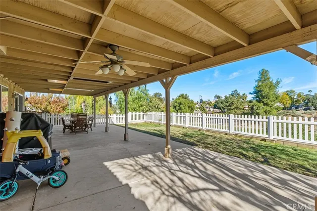 a view of a backyard with swimming pool