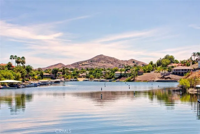 a view of residential houses with outdoor space and lake view