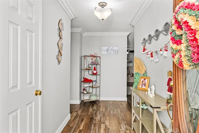 a view of a entryway with furniture and wooden floor