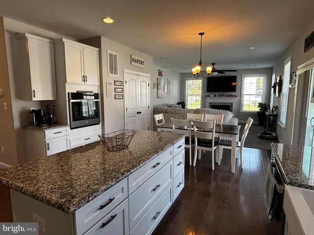 a view of a backyard with wooden fence