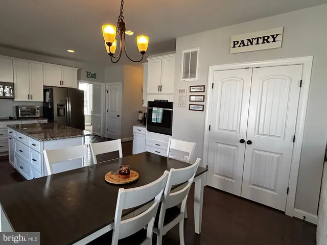 a living room with furniture window and a table