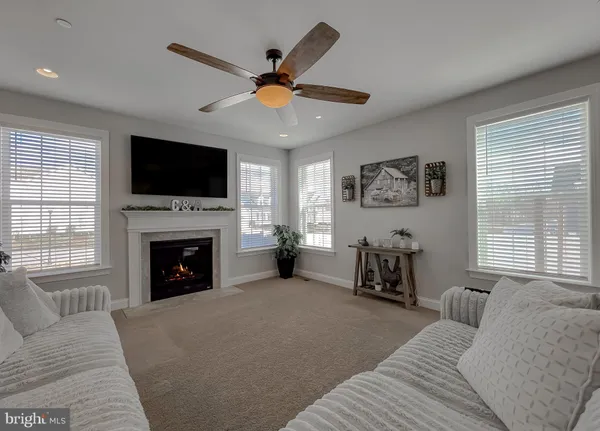 a kitchen with stainless steel appliances granite countertop a sink a stove and white cabinets