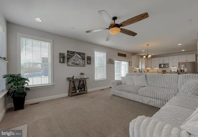 a spacious bedroom with a bed and window