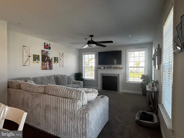 a bedroom with a bed closet and flat tv screen