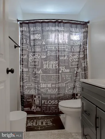 a spacious bedroom with a bed and a chair