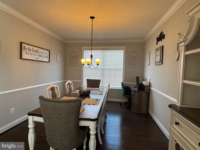 a bathroom with a tub sink vanity granite and a mirror