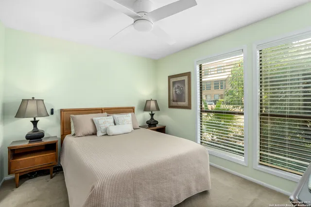 a bed room with a bed and a night stand