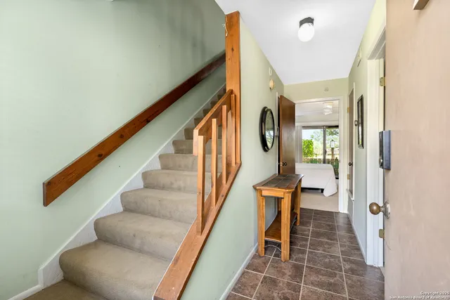 a kitchen with stainless steel appliances a sink and cabinets