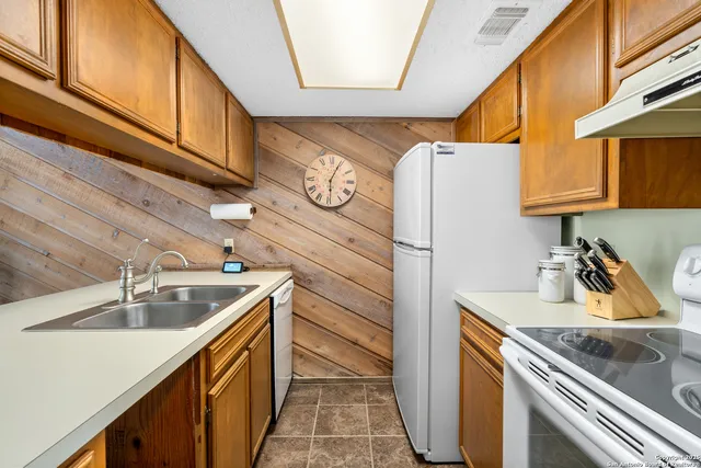 a kitchen with a stove and a table