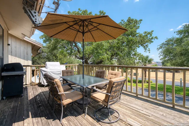 a table and chairs in patio of the house