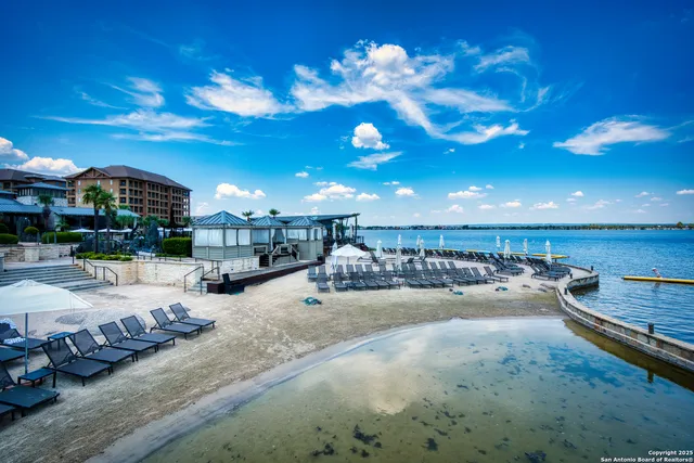 a front view of a house with a yard and a garage