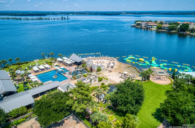 an aerial view of houses with outdoor space