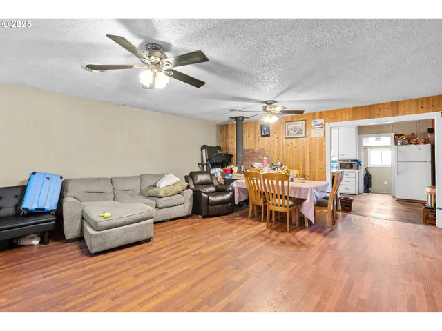 a bedroom with a bed and glass door