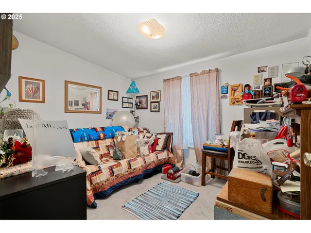 a bedroom with two beds and a window