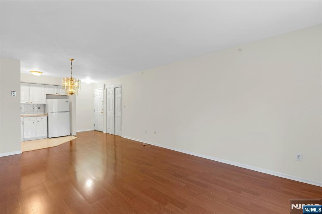 1419 Faulkner Court Mahwah, NJ 07430 - Photo 12 of 18 a view of an empty room with wooden floor
