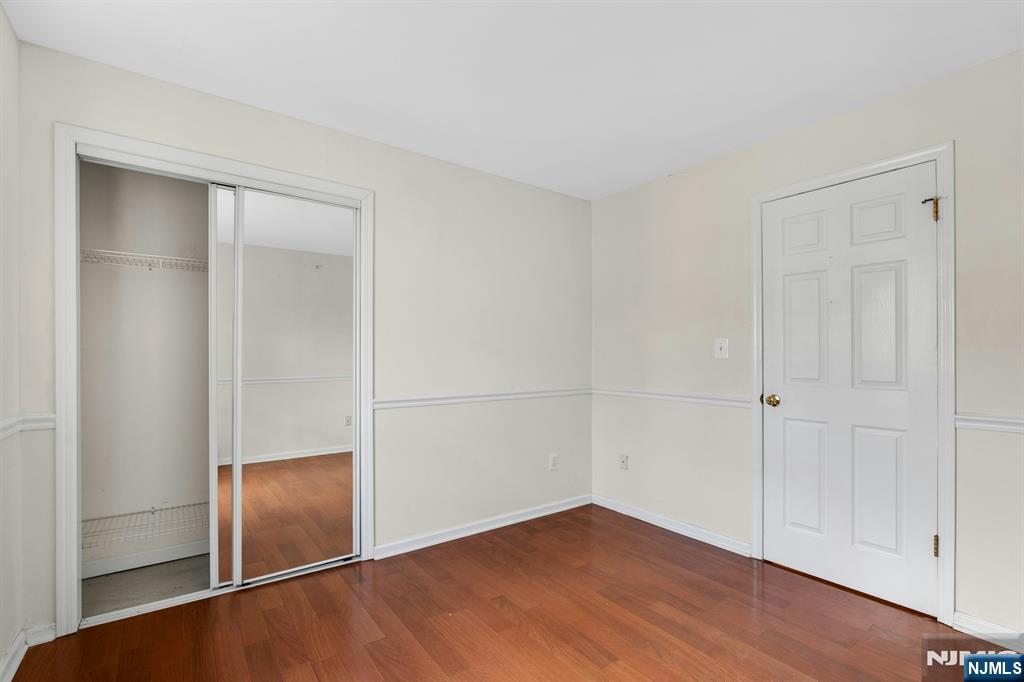 1419 Faulkner Court Mahwah, NJ 07430 - Photo 16 of 18 an empty room with wooden floor