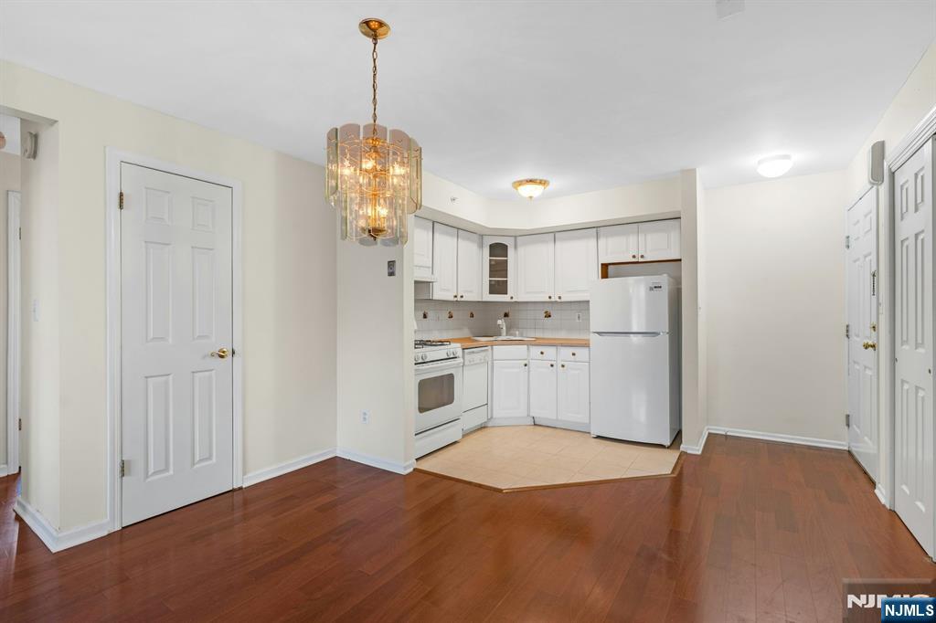 1419 Faulkner Court Mahwah, NJ 07430 - Photo 7 of 18 a open kitchen with white cabinets and stainless steel appliances