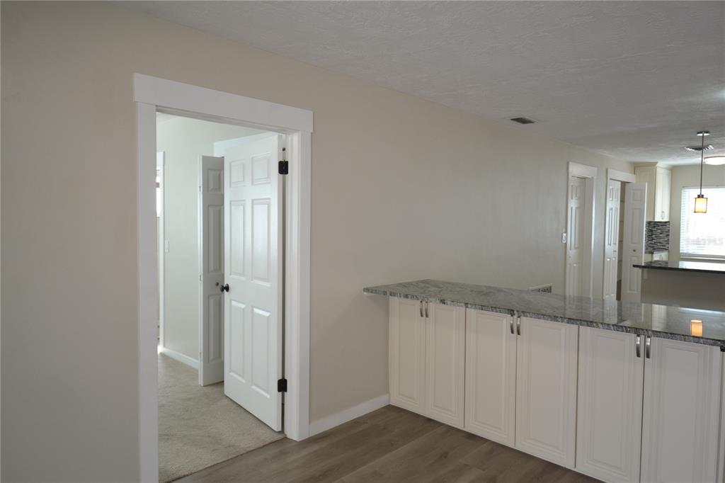 746 Barbara Street Palm Harbor, FL 34684 - Photo 11 of 54 a view of a hallway with wooden floor