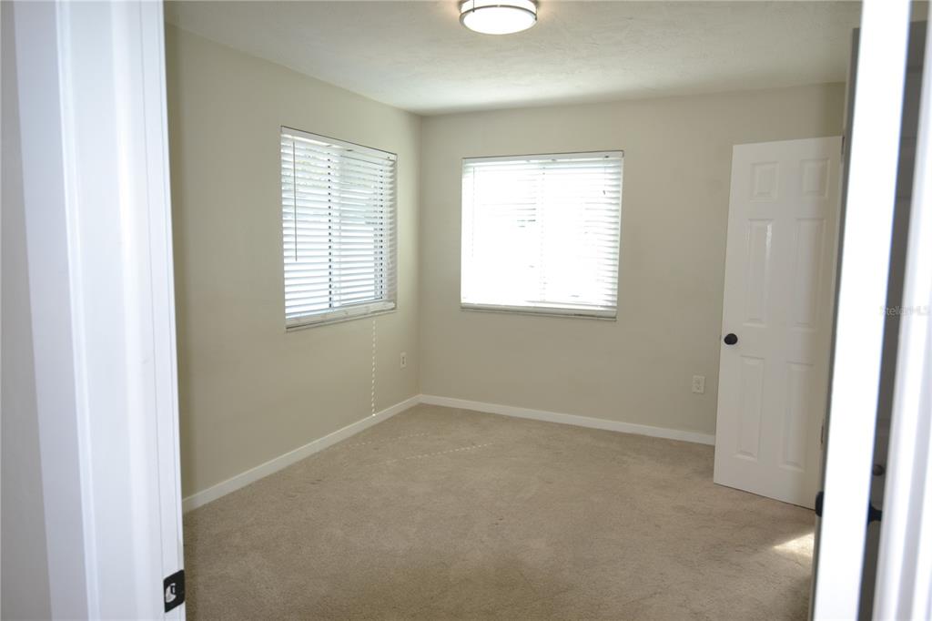 746 Barbara Street Palm Harbor, FL 34684 - Photo 12 of 54 an empty room with windows