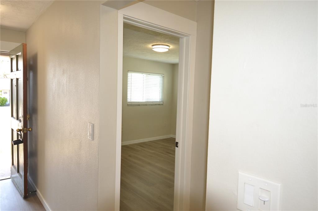 746 Barbara Street Palm Harbor, FL 34684 - Photo 16 of 54 a view of a bathroom from a hallway