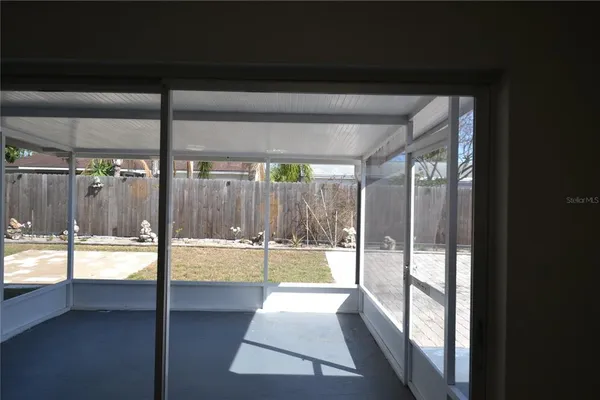 a view of a bathroom with a tub and window