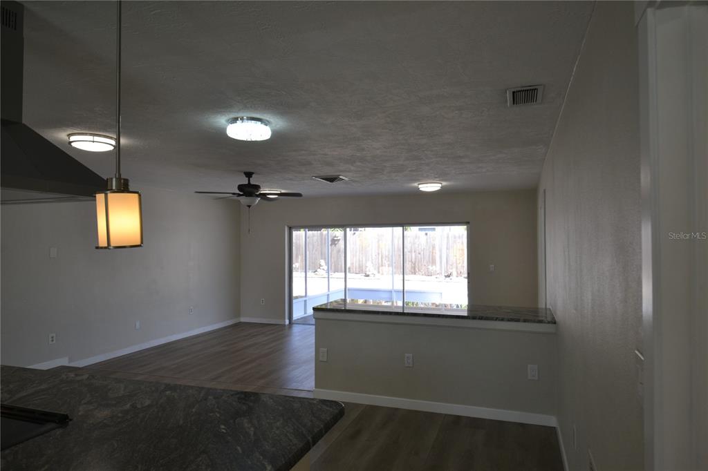 746 Barbara Street Palm Harbor, FL 34684 - Photo 6 of 54 a view of an empty room with a window