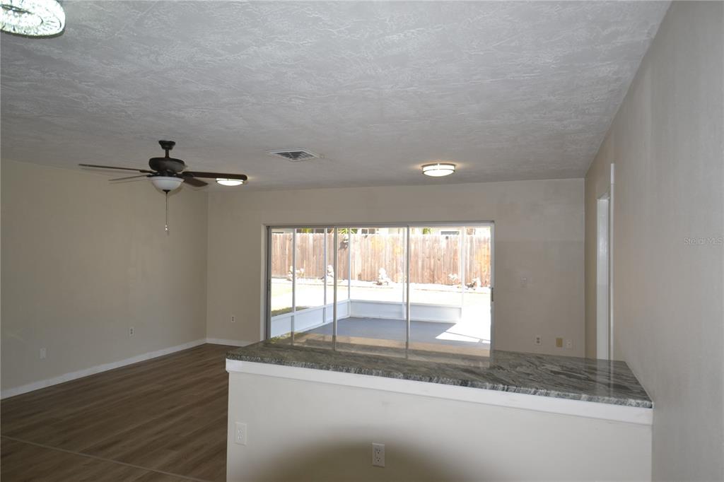 746 Barbara Street Palm Harbor, FL 34684 - Photo 8 of 54 a view of a kitchen with wooden floor and a window